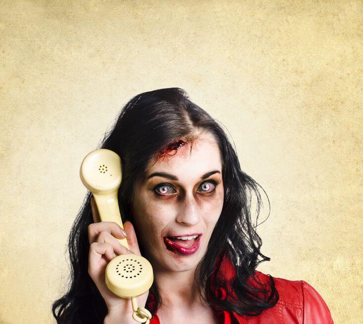 Woman zombie answering phone