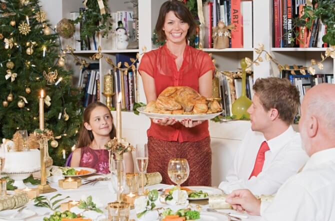 Family at dining table at Christmas