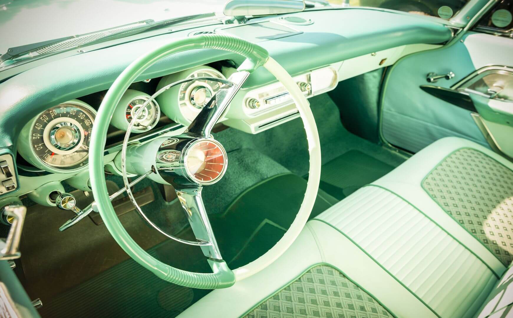 Looking in at the seats of an old automobile