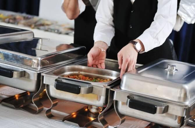caterers setting up buffet station