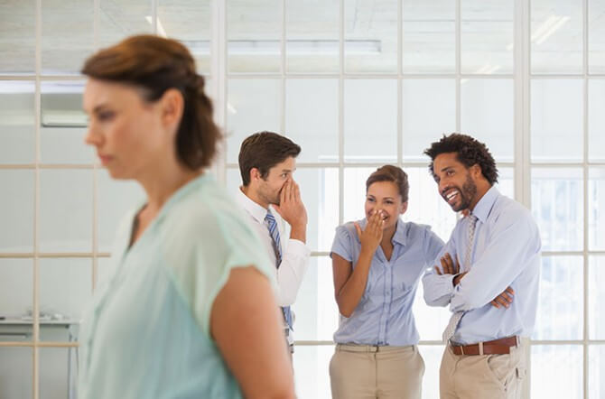 Woman being defamed by coworkers