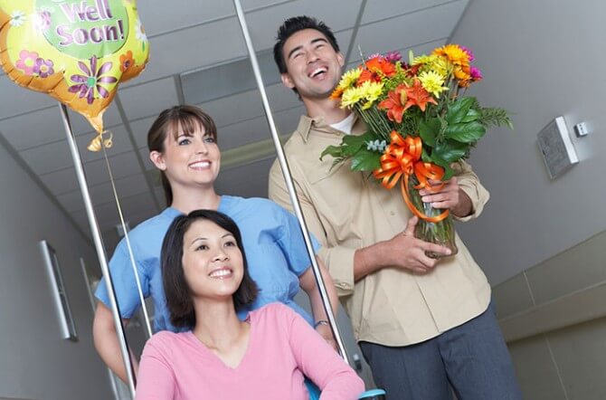 couple at hospital with flowers