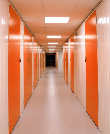 Self Storage Corridor with Green Doors