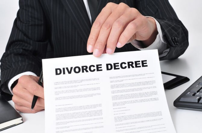 man holding divorce decree