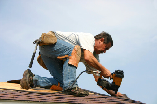 roofer - man repairing roof