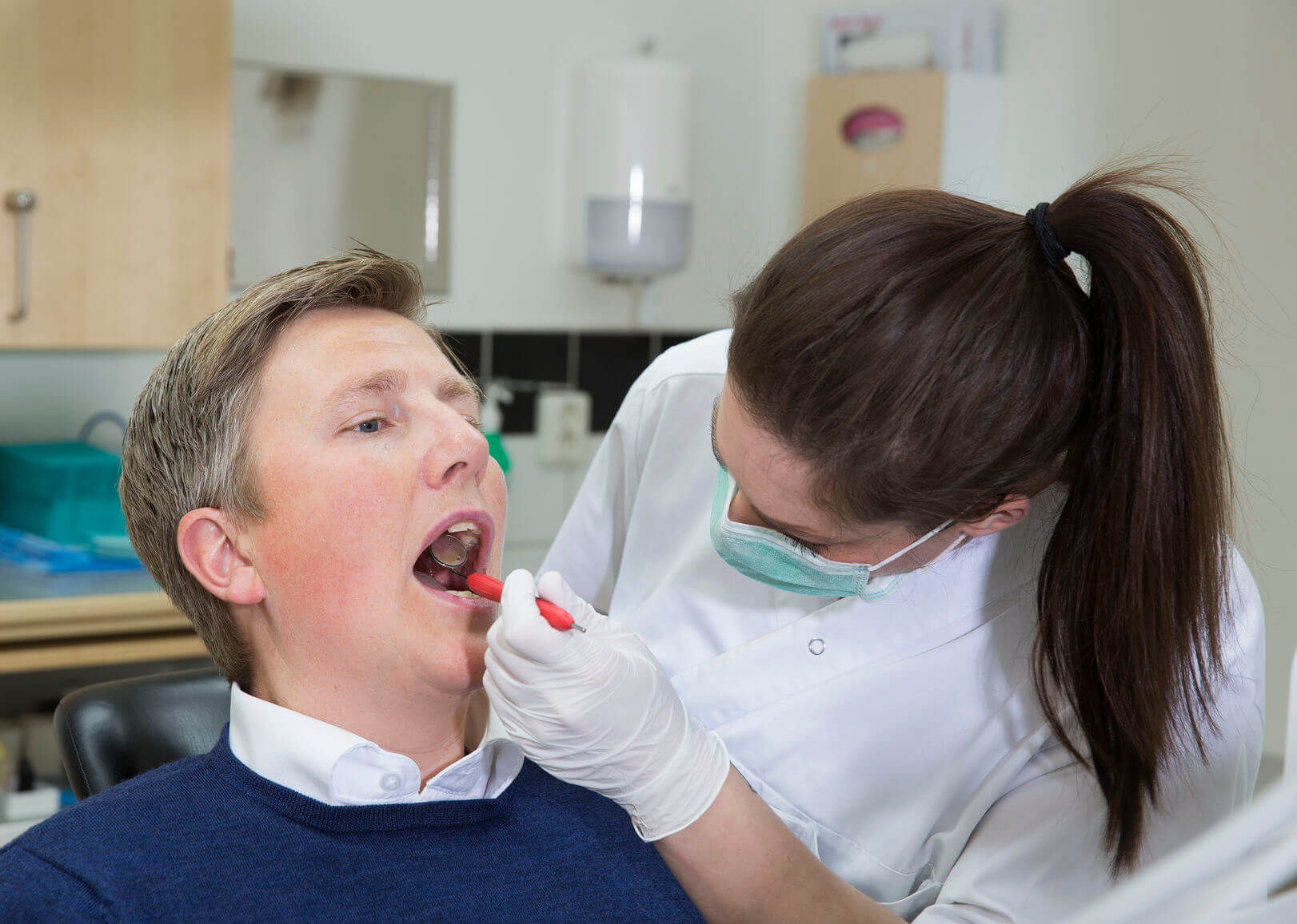dentist with male patient