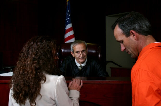 Defendant with attorney and judge