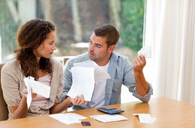 Couple looking at financial documents