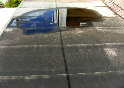 Image of a flat roof in need of repair