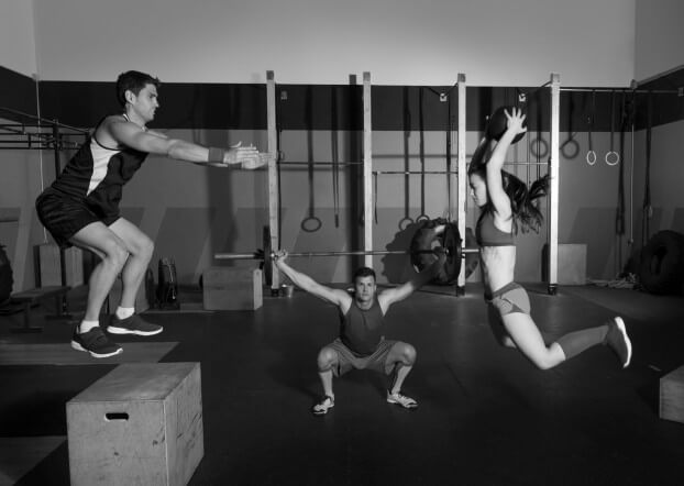 gym group workout barbells slam balls and jump
